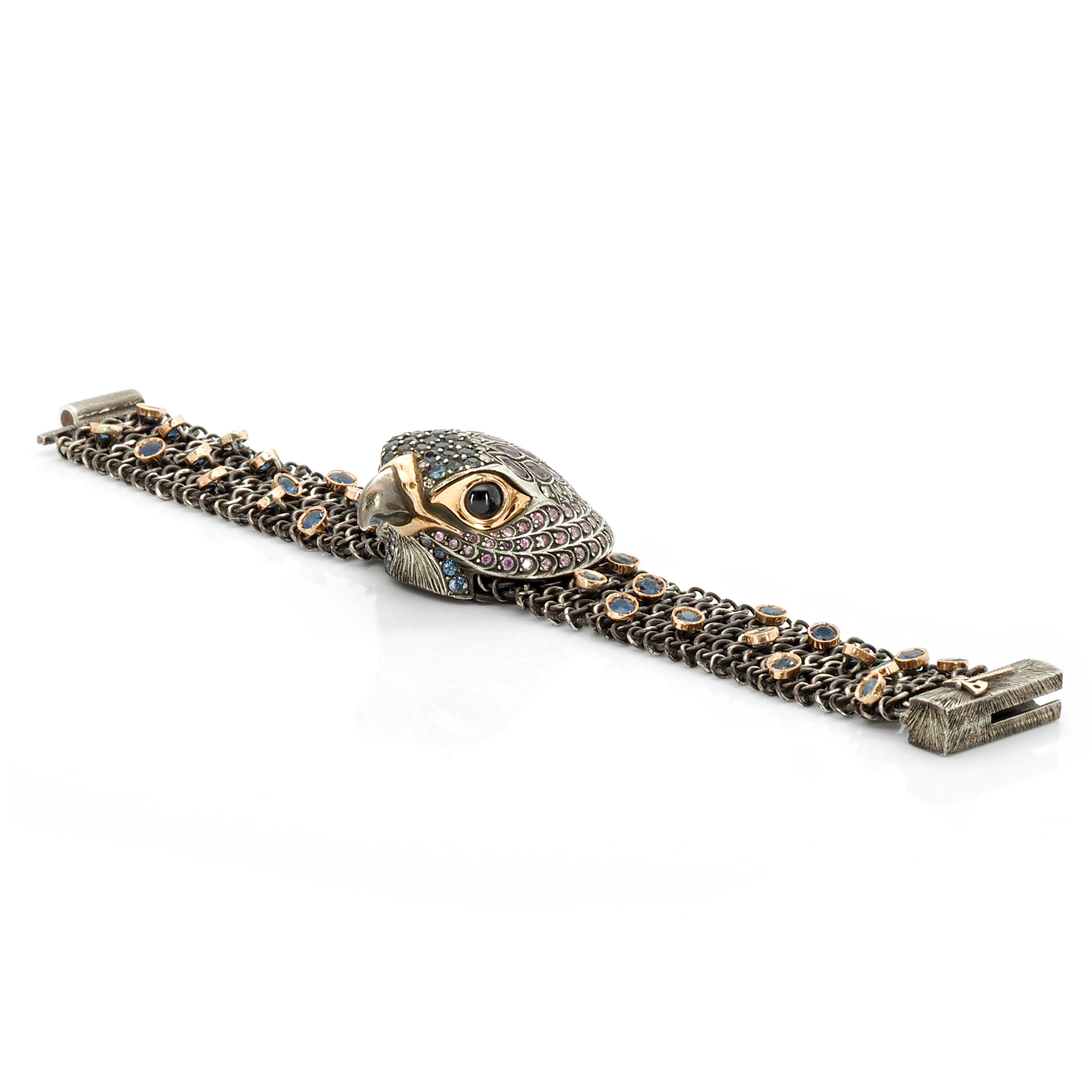 Taru Jeweley Falcon Bracelet is crafted from 18K rose gold, sterling silver, and featuring a stunning array of blue and pink sapphires in various cuts.