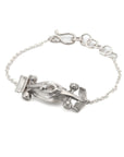 Taru Jewelry Race Car Bracelet is a stunning piece that captures the essence of speed and adrenaline. Crafted from sterling silver, this bracelet features a sleek and aerodynamic race car design complete with intricate details. The streamlined body of the car creates a sense of movement and energy. The wheels of the car are finely detailed and perfectly balanced, ready to take on any race course. The curvature of the car allows the bracelet to hug around the contours of the wrist perfectly.