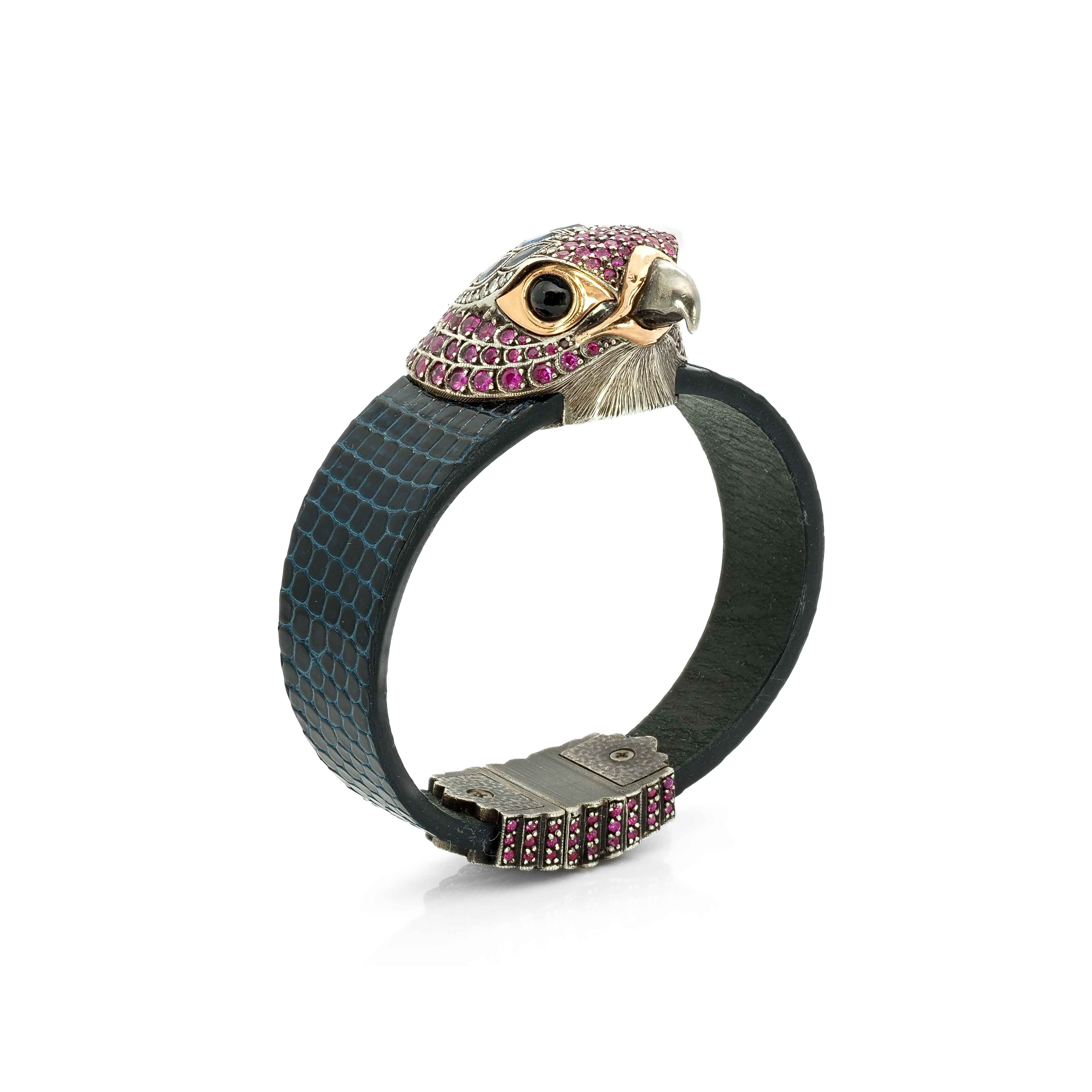 Taru Jewelry Falcon Bracelet is crafted from 18K rose gold, sterling silver, and featuring a stunning array of blue and pink sapphires in various cuts. The falcon is known for its sharp and piercing gaze, and this is perfectly captured in the design of this bracelet.