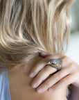 Taru Jewelry Falcon Ring is crafted from 18K rose gold, sterling silver, and featuring a stunning array of yellow sapphires and rosecut diamonds. The falcon is known for its sharp and piercing gaze, and this is perfectly captured in the design of this ring.