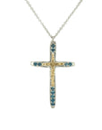 Taru Jewelry Cross Necklace made of 18K yellow gold and sterling silver is a beautiful combination of traditional symbolism and modern design. The cross, a timeless symbol of faith and devotion, is adorned with sparkling blue topaz, adding a touch of color and elegance to the piece.