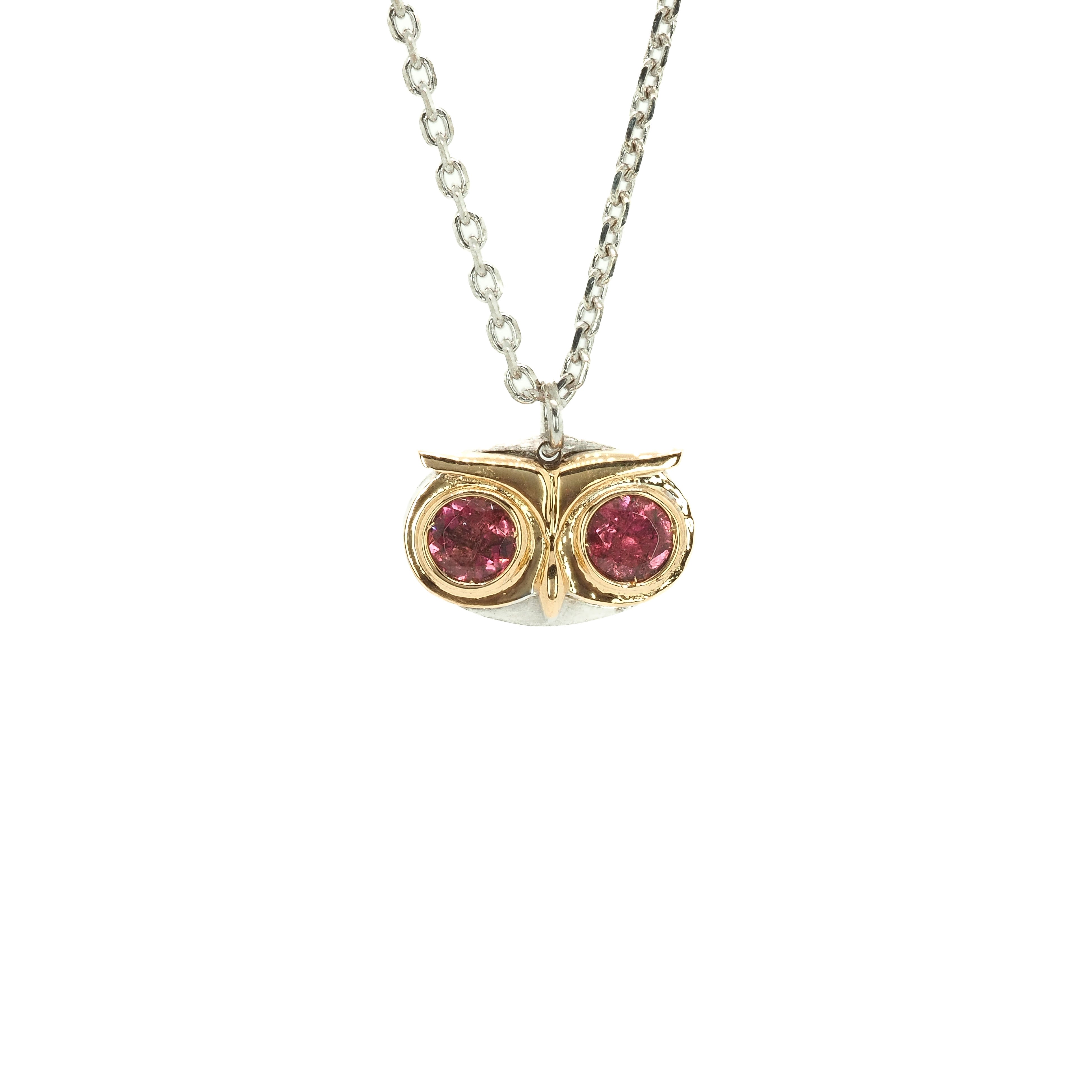 Taru Jewelry lovely owl necklace, handcrafted from 18K gold and sterling silver, captures the essence of the wise and mysterious bird. The owl&#39;s eyes are set with sparkling tourmaline gemstones, adding a touch of color and elegance to the piece. The owl represents a symbol of wisdom and the ability to see and hear what others may miss. With its protective gaze and ability to to go unseen, the owl is considered an ideal messenger of secrets.