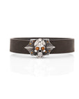 Make a bold fashion statement with Taru Jewelry Skull and Roses bracelet. Decorated with delicate rose engravings, it features glittering citrine roses and shining eyes on the skull design, making it a truly unique piece. The bracelet is strapped by a dark brown leather strap, making it both stylish and comfortable to wear.