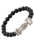 The Race Car Black Onyx Bracelet is a stylish and sleek piece of jewelry that is perfect for those who love cars or racing. It is made from black onyx beads and features a small silver race car charm. The bracelet is stretchy and comfortable to wear, and can fit most wrist sizes. The black onyx beads are said to have protective energy and are believed to help with stress and anxiety. This bracelet is a great accessory for any car enthusiast or anyone who loves unique and trendy jewelry.