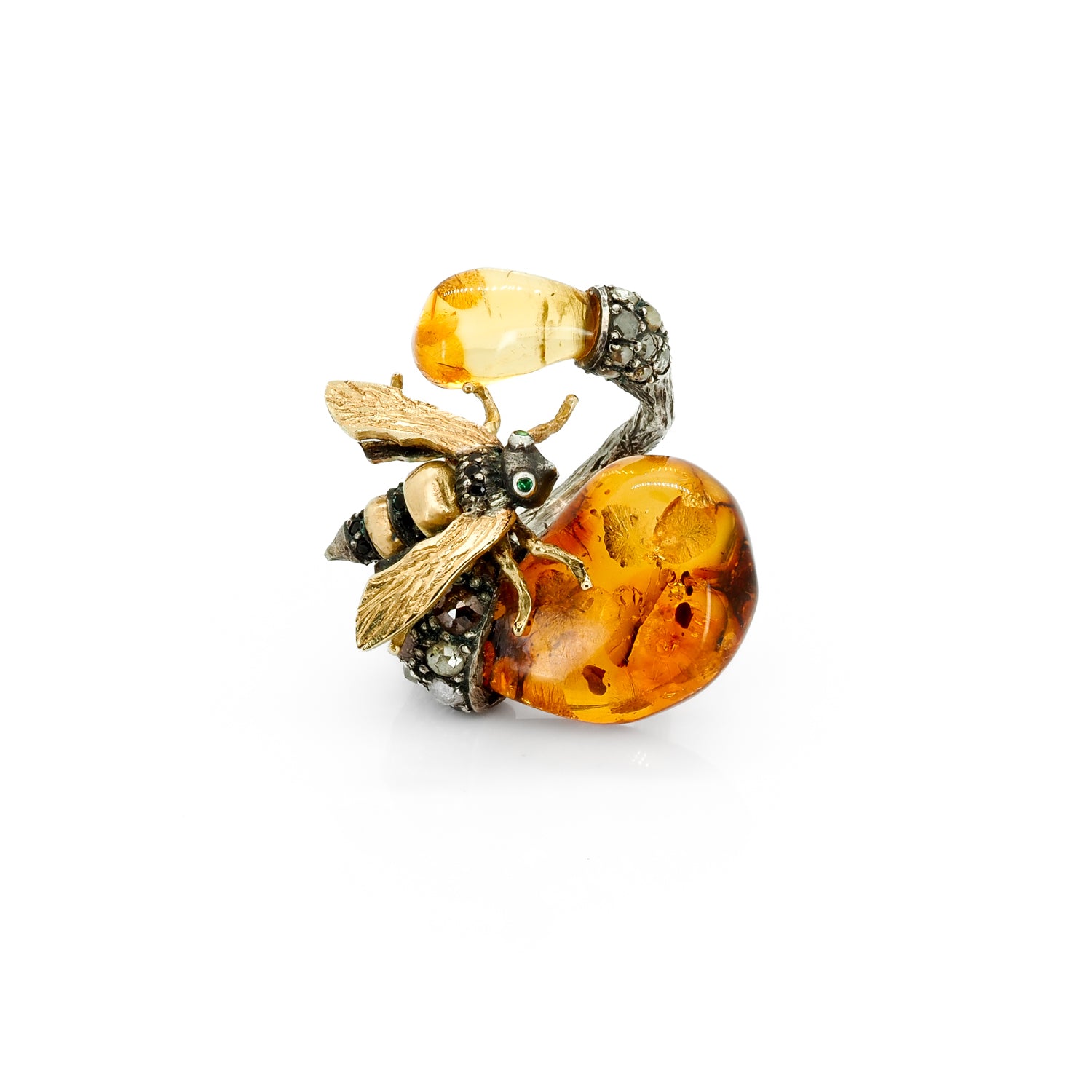 Taru Jewelry Bee Ring made of 18K yellow gold and sterling silver is centered with a gorgeous amber stone that mimics the hue of honey, upon which the bee rests.