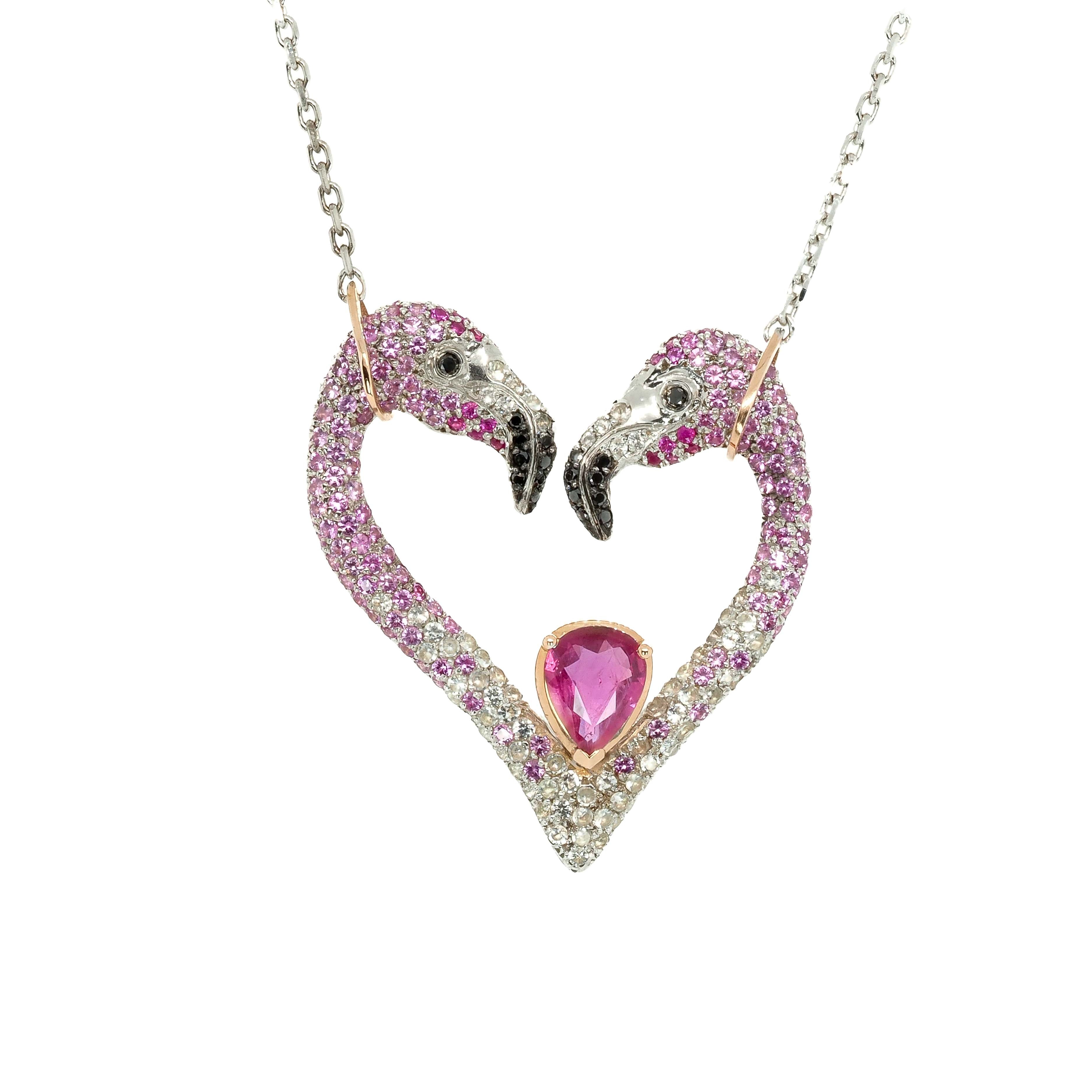 Taru Jewelry Flamingo Heart Necklace in 18K rose gold and sterling silver is a unique piece of jewelry. The design features two flamingos forming a heart shape, encrusted with pink and white sapphires and black diamonds.