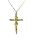 Taru Jewelry Cross and Infinity Necklace crafted from 18K yellow gold and silver is a beautiful combination of traditional symbolism and modern design. The cross, a timeless symbol of faith and devotion, is adorned with sparkling green peridot, adding a touch of color and elegance to the piece.