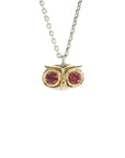 Taru Jewelry lovely owl necklace, handcrafted from 18K gold and sterling silver, captures the essence of the wise and mysterious bird. The owl's eyes are set with sparkling tourmaline gemstones, adding a touch of color and elegance to the piece. The owl represents a symbol of wisdom and the ability to see and hear what others may miss. With its protective gaze and ability to to go unseen, the owl is considered an ideal messenger of secrets.